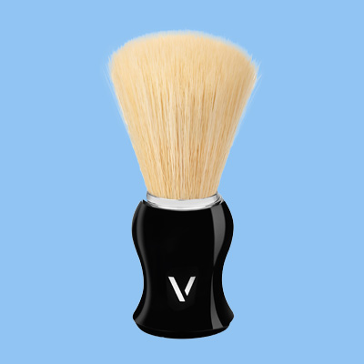 vali shaving brush on blue background