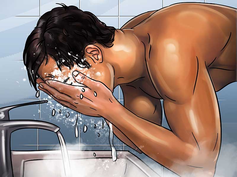 man washing face after shaving